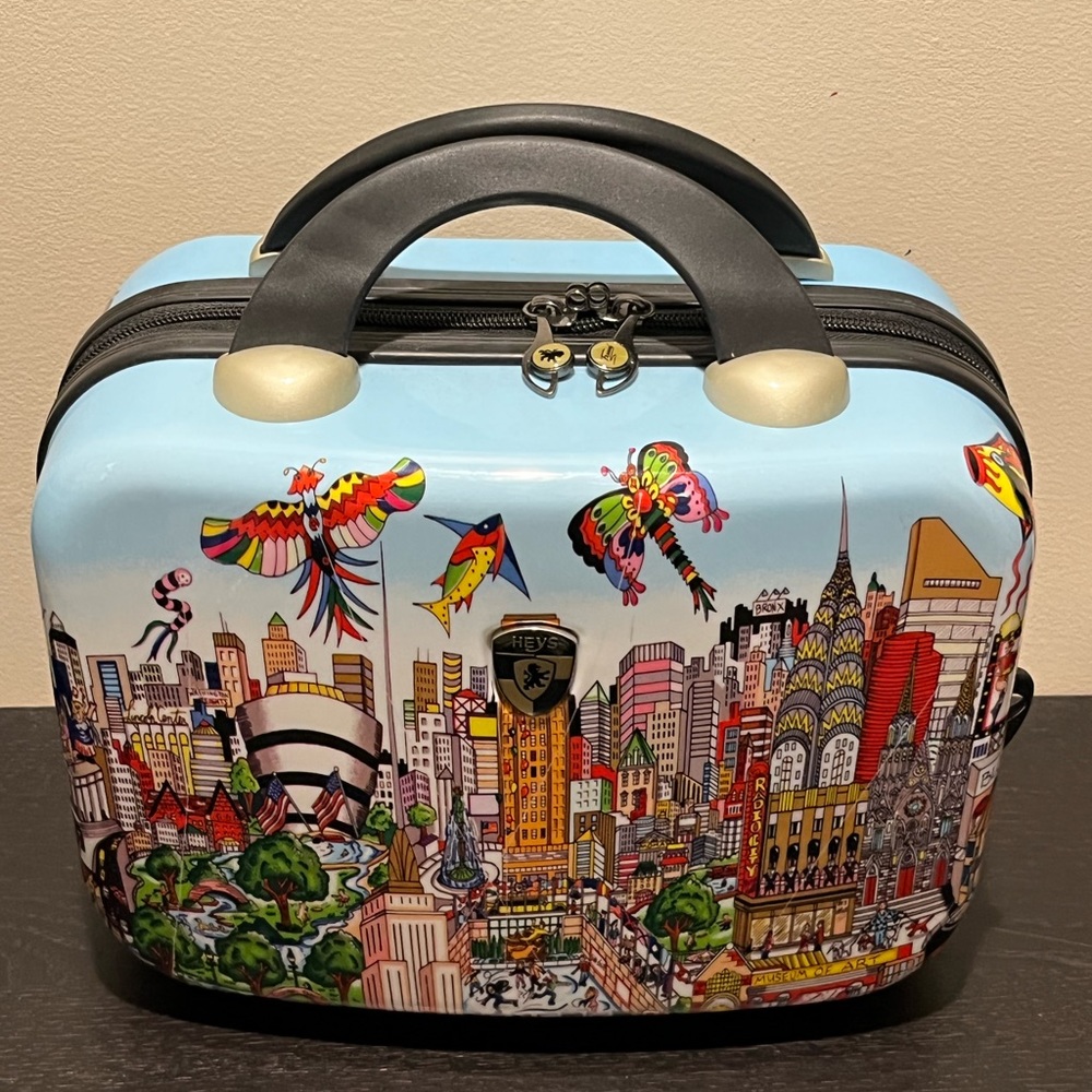 Heys hard covered  costmetic case,  easily attaches to your suitcase handle.